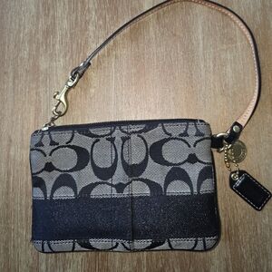 Coach Signature Black Wristlet With Leather Strap With brass Hardware.
